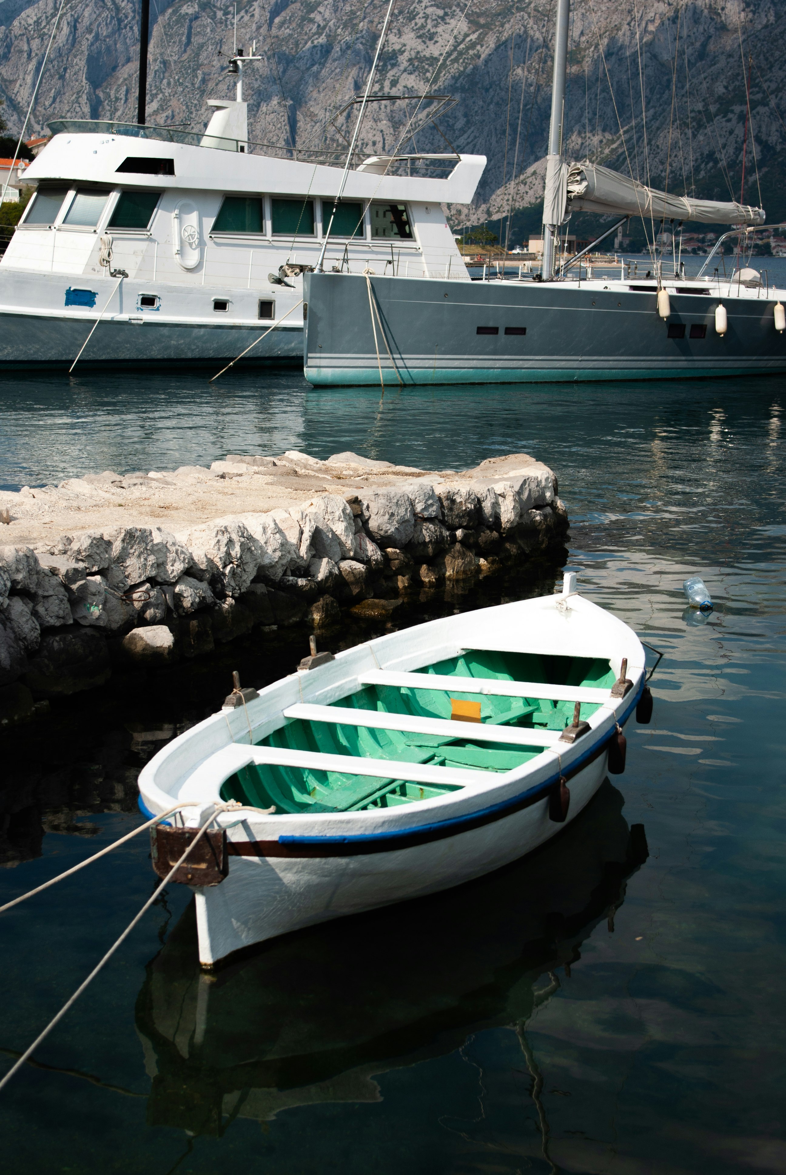 white and green boat on body of water during daytime